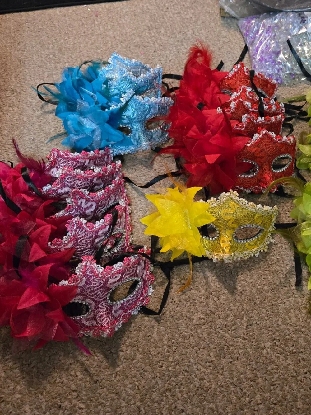 you get 5 random plastic, some fabric covered with feathers, masks